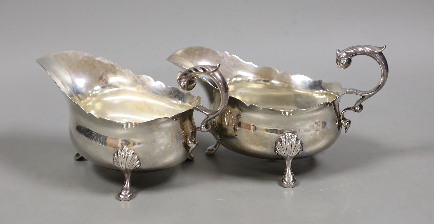 A pair of George V silver oval sauceboats, by Wilson & Gill, London, 1935/6, 15.9oz.